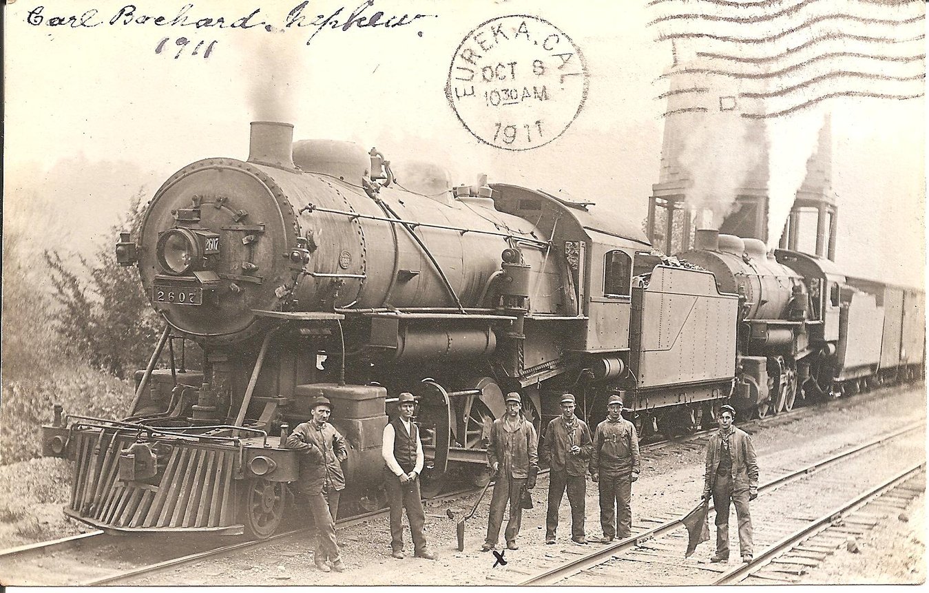Old photograph of train and workers Old photograph of train and workers
